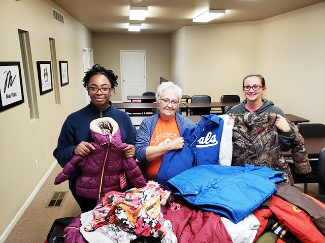 Today's Civic Women collecting coats